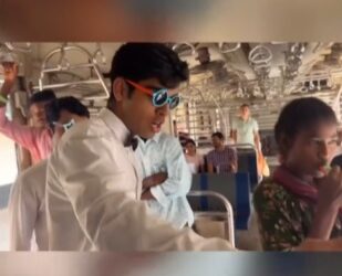 Two youths convert a Mumbai local train compartment into a dining area