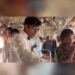 Two youths convert a Mumbai local train compartment into a dining area