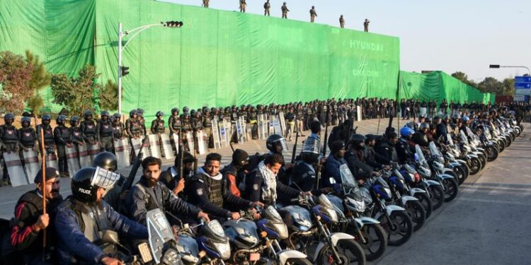 Supporters of Khan continue their march, demonstrating unwavering commitment.