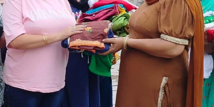 Anmol Muskan Kanti W/o Deep Singh Charitable Trust distributes clothes to needy families in Village Gharuan